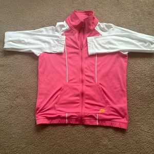 Nike track suit pink with gold letters and white sleeves size large.